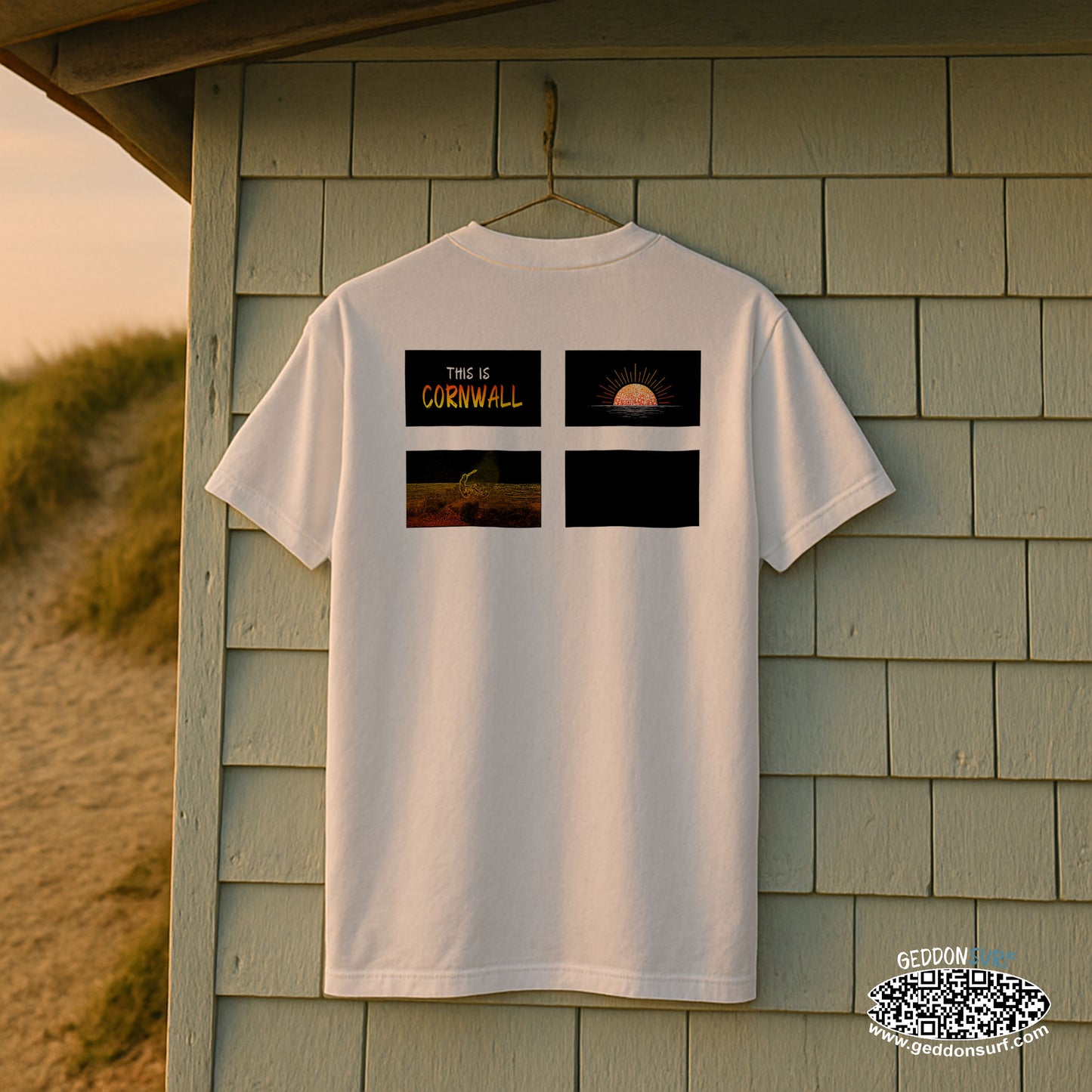 White t-shirt with cornish flag design, sun, surfer and 'This is Cornwall' text on a wooden shed background
