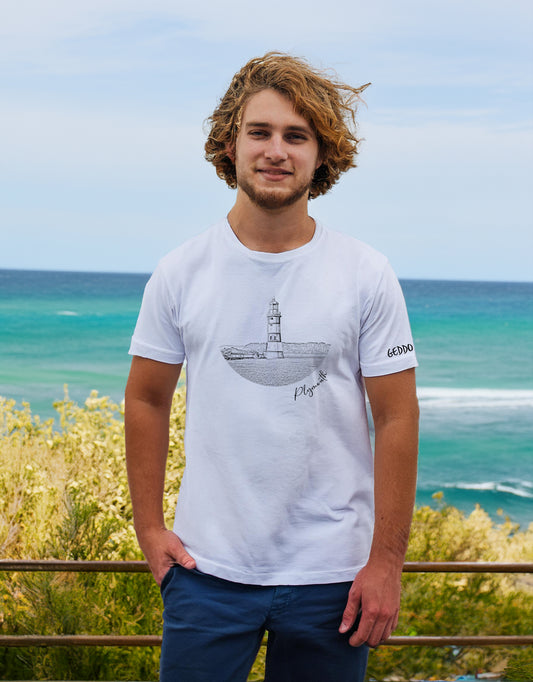 Model wearing a white t-shirt featuring a black line art design of Smeaton’s Tower Lighthouse in Plymouth. A stylish and comfortable 100% cotton lighthouse t-shirt, perfect for coastal and maritime enthusiasts. Available in S to 5XL.
