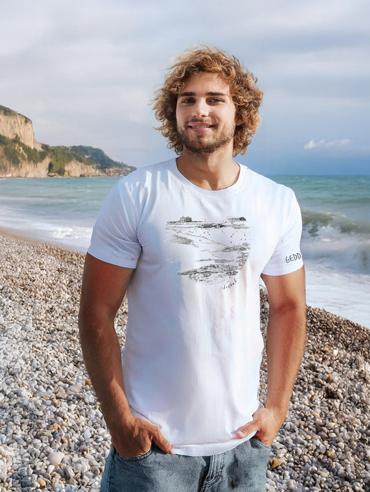 Model wearing the Fistral Beach Line Art T-Shirt in white, featuring minimalist grey line art of Fistral Beach.