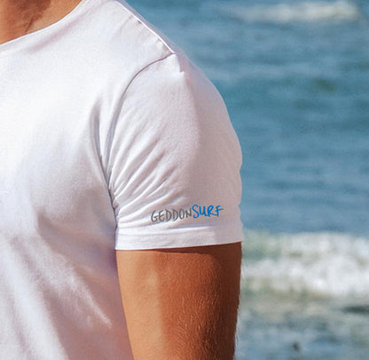 Close-up of the GeddonSurf branding on the sleeve of the Fistral Beach Line Art T-Shirt.