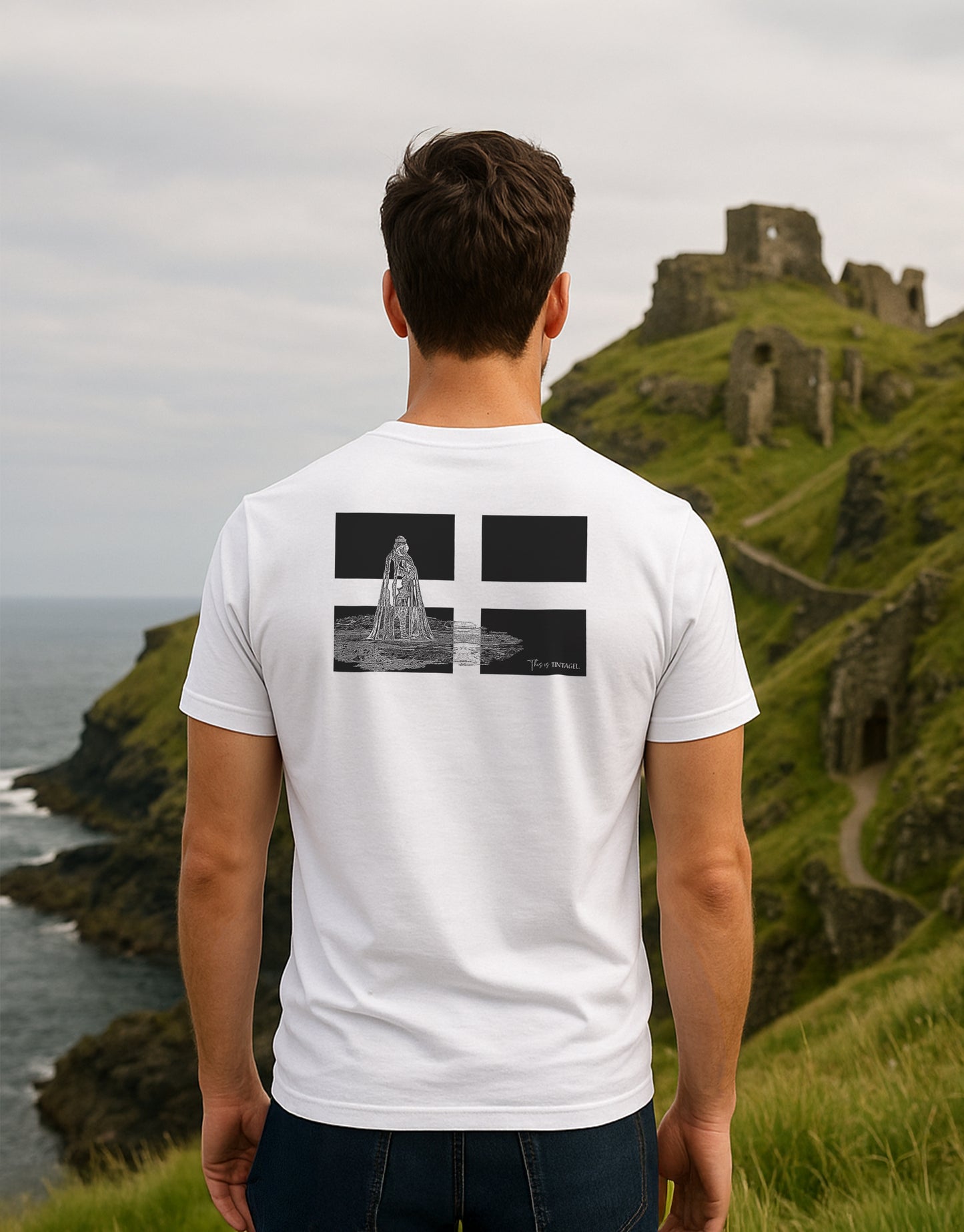 Back of “This is Tintagel” t-shirt worn by model – King Arthur statue overlaid on Cornish flag, design inspired by Tintagel Castle, Cornwall

