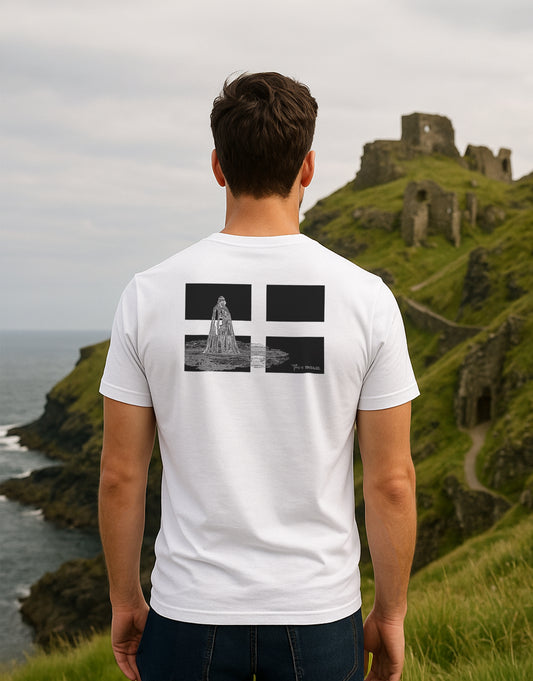 Back of “This is Tintagel” t-shirt worn by model – King Arthur statue overlaid on Cornish flag, design inspired by Tintagel Castle, Cornwall


